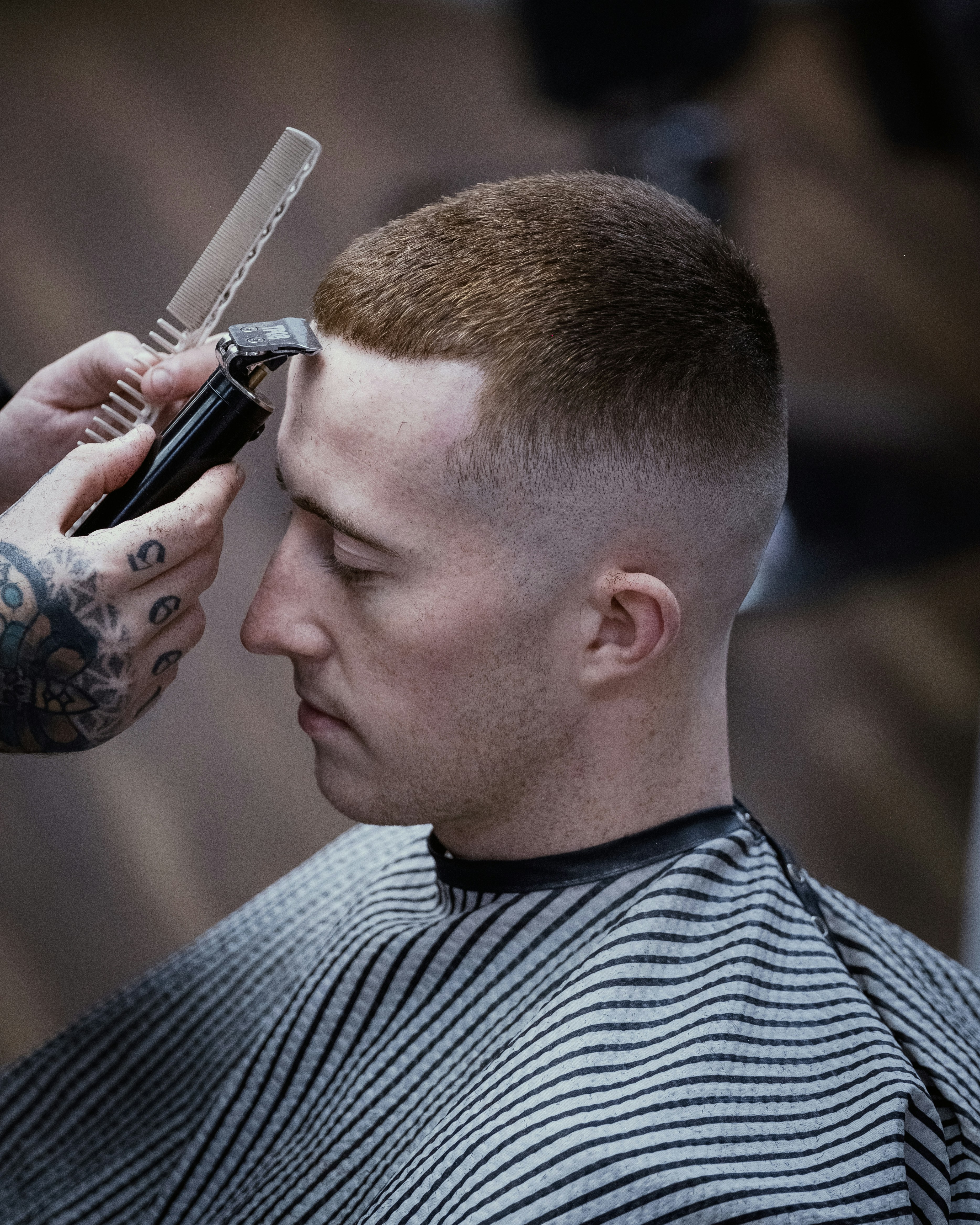 Sharp fade haircut with clean line-up